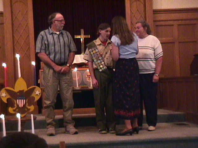 Eagle Scout receiving Medal from mother